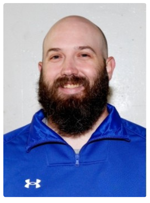 Portrait of the Lake Region State College women’s hockey coach wearing a blue athletic pullover.