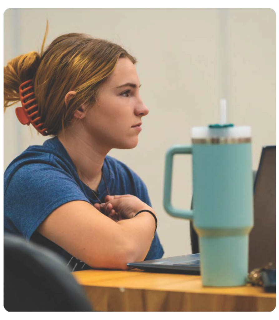 Female Student in Classroom. 