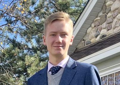 young blonde man with a tux on