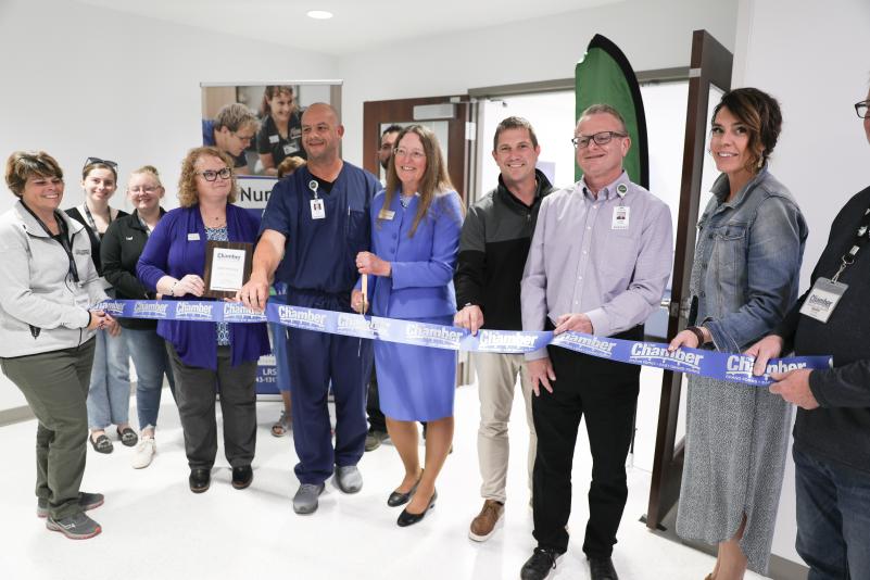 members of LRSC and Altru along with GF Chamber ambassadors prepare to cut the ribbon