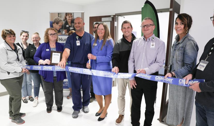 members of LRSC and Altru along with GF Chamber ambassadors prepare to cut the ribbon